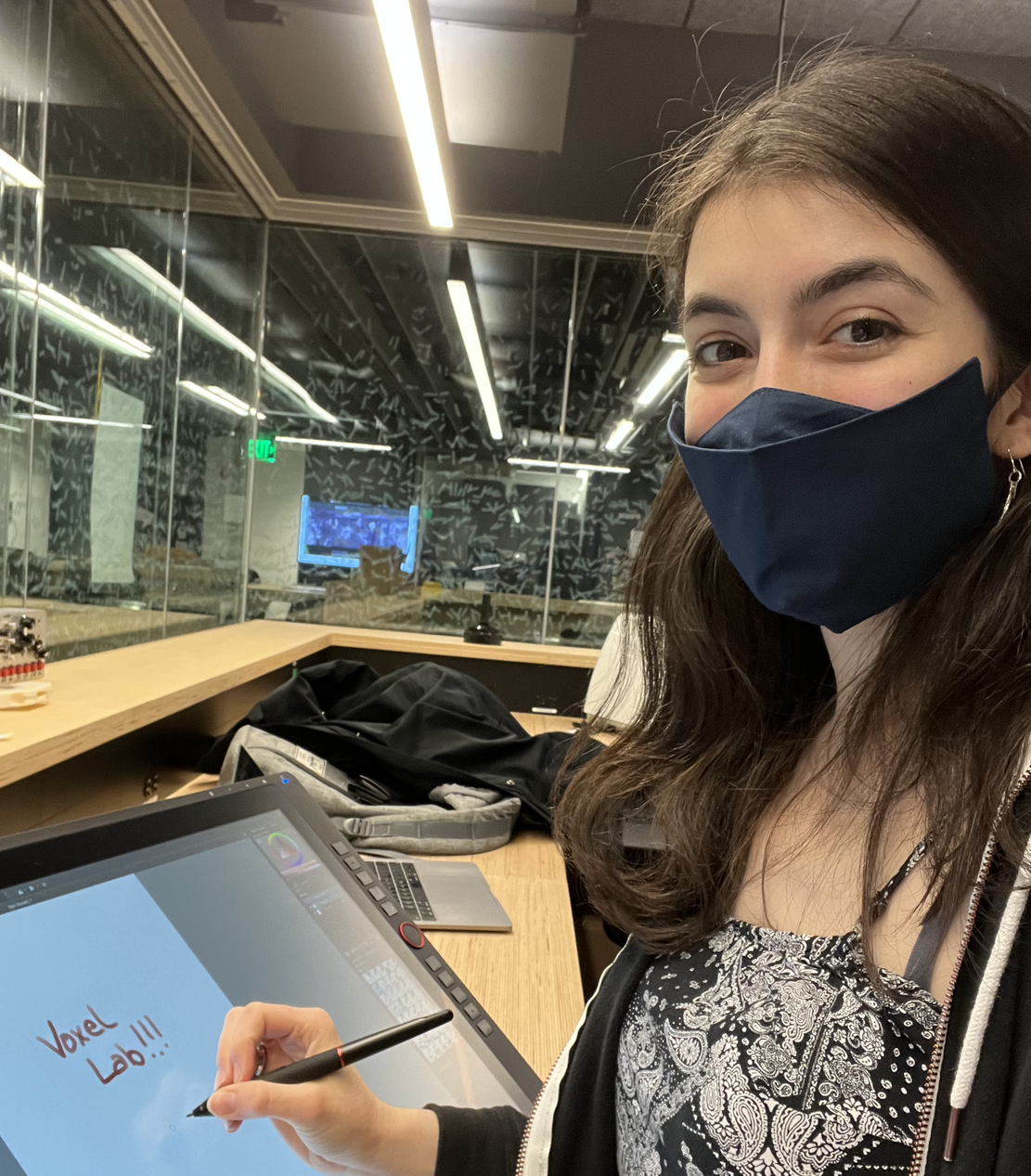 lola writes on a tablet in the voxel lab